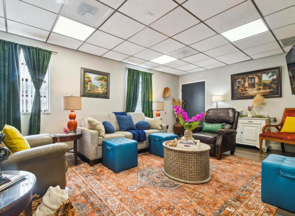 a living room with a large painting